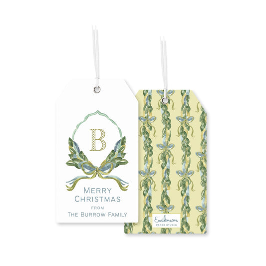 two tags, one with a floral design and the other with a repeating pattern of green leaves and blue flowers.