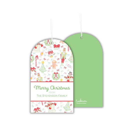 a pair of Christmas-themed gift tags hanging against a white background.