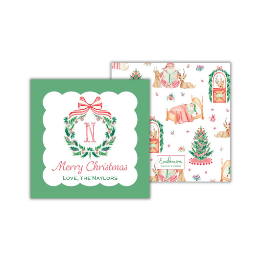 two Christmas-themed greeting cards. The first card has a green background with a wreath and the letter &quot;N&quot; in the center, and the text &quot;Merry Christmas&quot; and &quot;LOVE, THE NAYLORS&quot; below. The second card has a white background with a repeating pattern of Christmas trees and animals, and the text &quot;Enamelon Paper Station&quot; and &quot;Love, the NAYLORS&quot; below.
