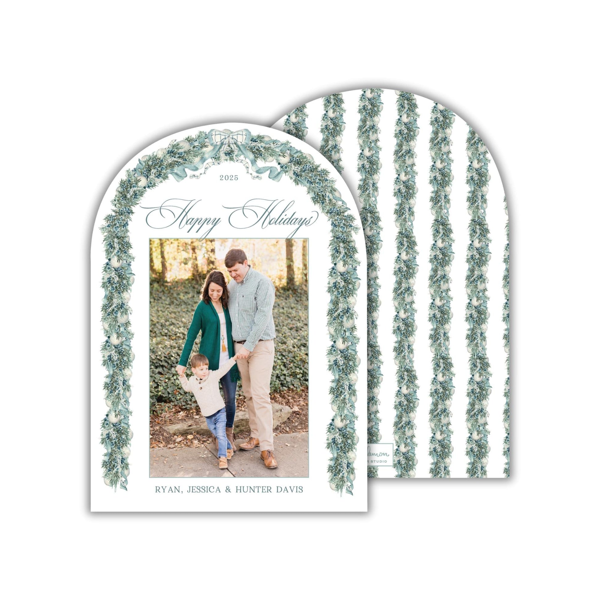 A 2015 holiday greeting card featuring a family photo of a man, woman, and child standing together in a garden setting.