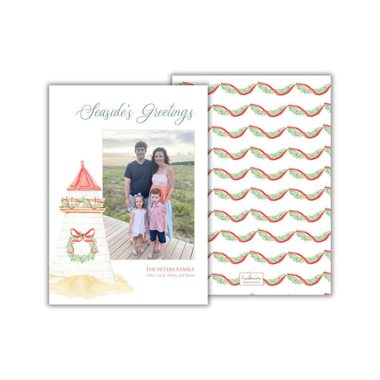 A family portrait of a man, woman, and two children standing in front of a lighthouse, with a wreath on the lighthouse and a repeating pattern of red and green waves on the background.