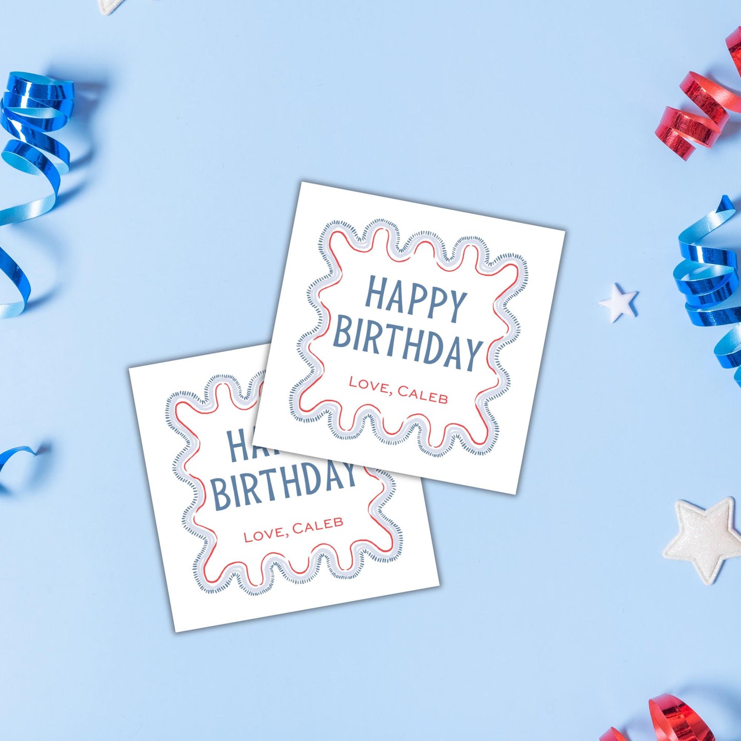 two birthday cards with the text "Happy Birthday" and "Love, Caleb" printed on them, along with some confetti and streamers in the background.