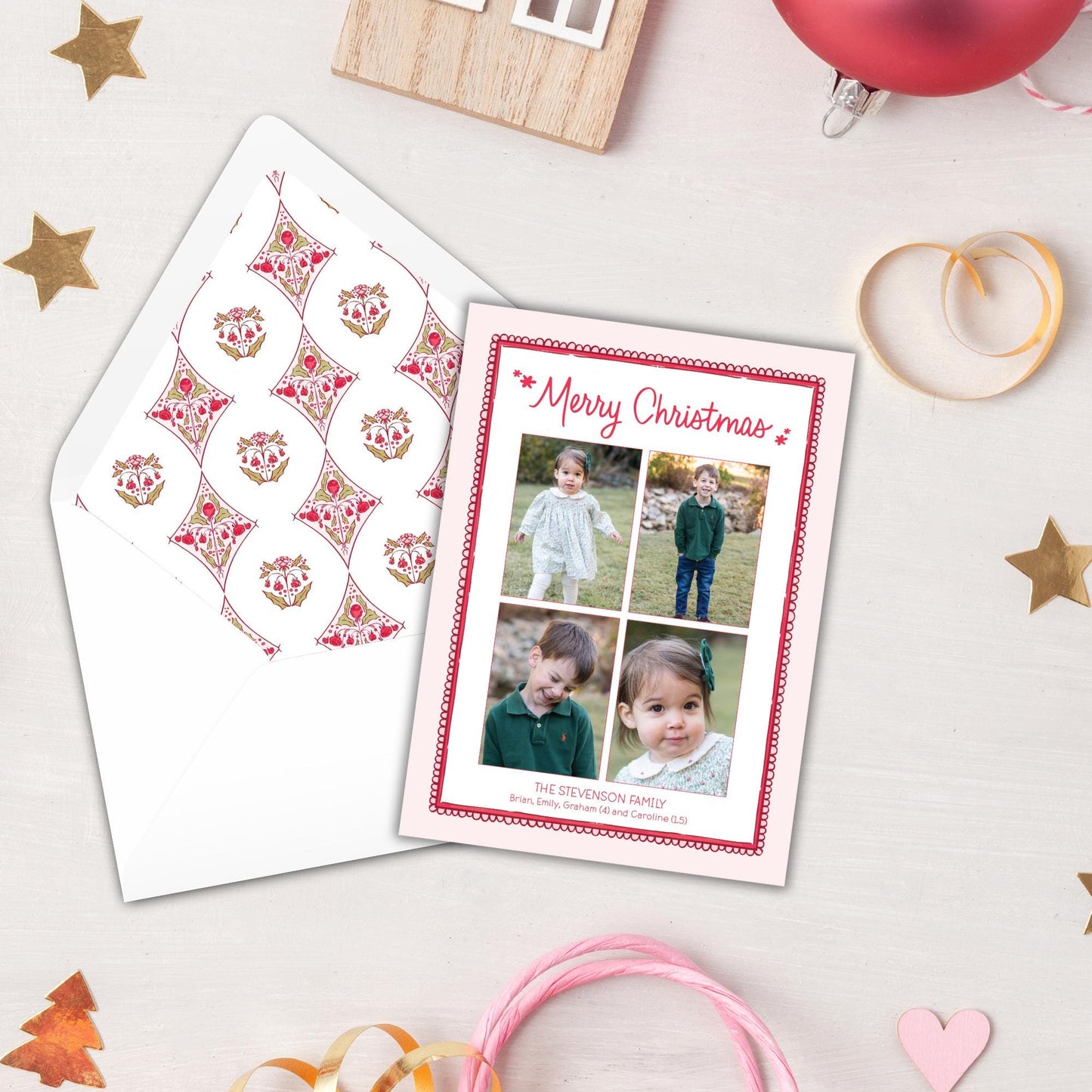 a Christmas card with a photo of children, surrounded by festive decorations such as stars, a small house, and a red ornament.