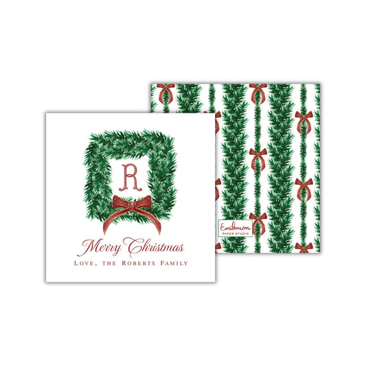 The image is a Christmas card featuring a wreath with a ribbon and the letter &quot;R&quot; in the center. The card has a personalized message that reads &quot;Merry Christmas Love, the Roberts Family&quot;.