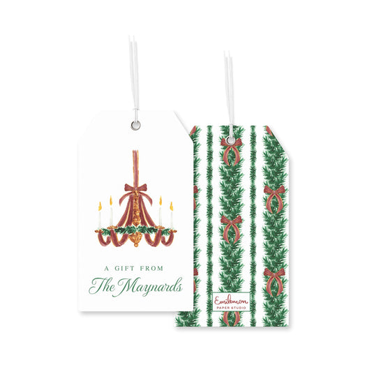 a pair of white tags with Christmas-themed illustrations and text.