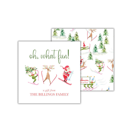 The image is a gift card design featuring a winter scene with various holiday-themed elements, including reindeer, Santa Claus, and snowmen. The text on the gift card reads "oh, what fun! A gift from THE BILLINGS FAMILY".
