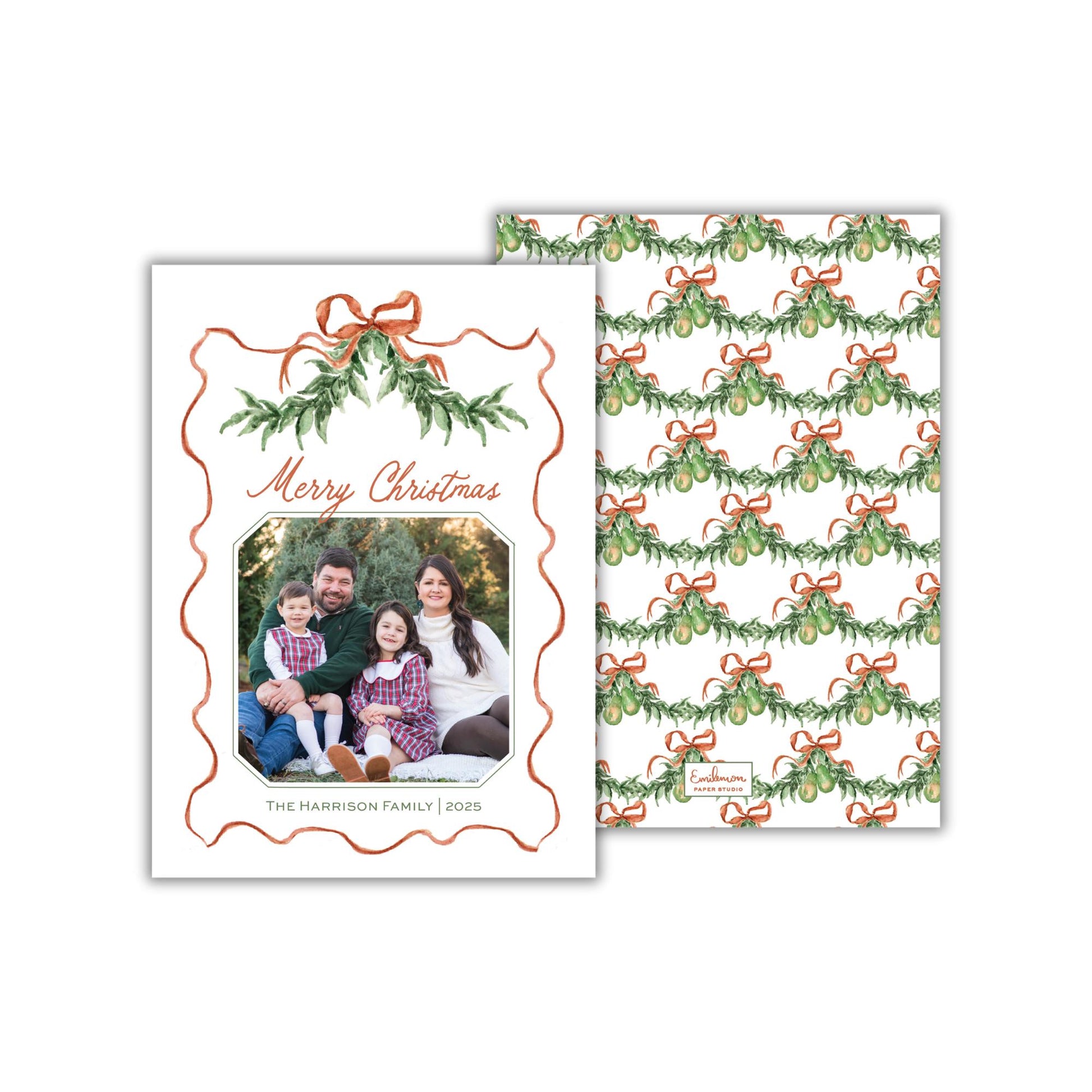 The image is a Christmas card featuring a family photo of a man, woman, and child. The card has a festive design with a pattern of green and red bows and a wreath. The text on the card reads &quot;Merry Christmas&quot; and &quot;THE HARVARD FAMILY 2015&quot;.