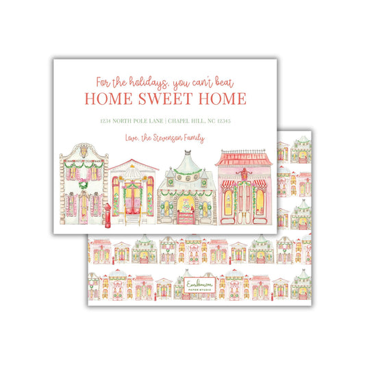 The image is a holiday-themed card featuring a repeating pattern of colorful houses and buildings, along with a message about home sweet home.