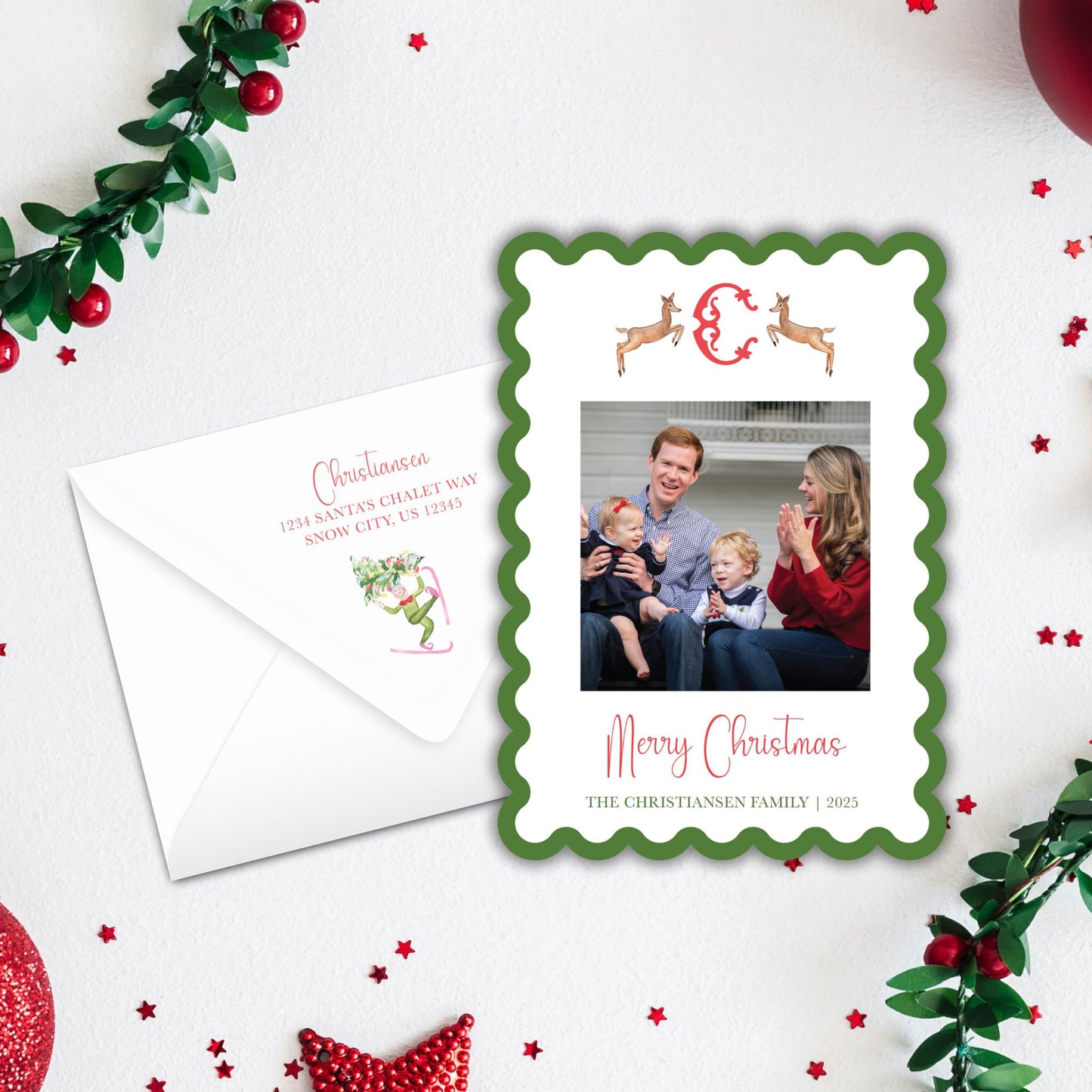 A Christmas card with a family photo and a white envelope with a holiday decoration.