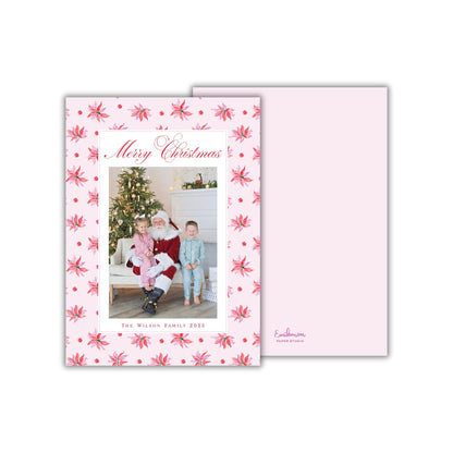 A pink Christmas card featuring a photo of Santa Claus and two children, with the text "Merry Christmas" and "The Wilson Family 2005" printed on it.