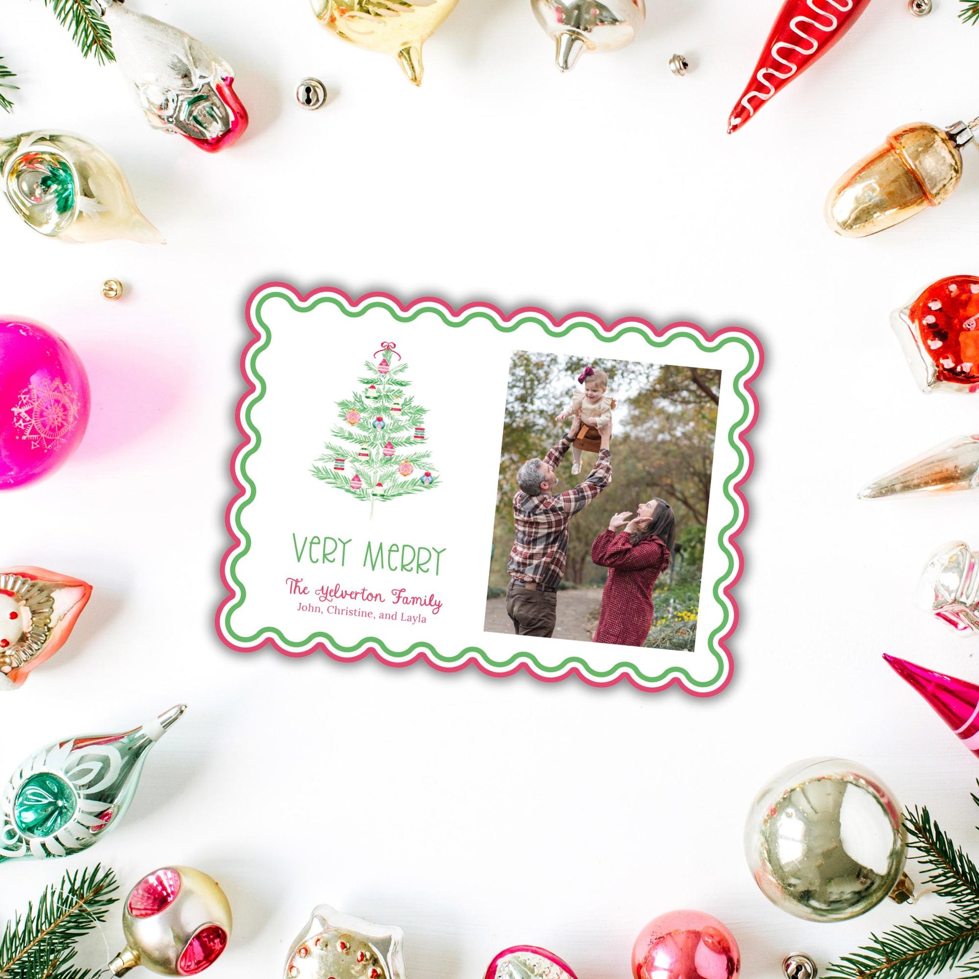 A Christmas card with a photo of a family, surrounded by various ornaments and decorations, including a Christmas tree and ornaments.