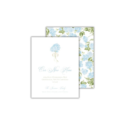 a wedding card with blue flowers on it
