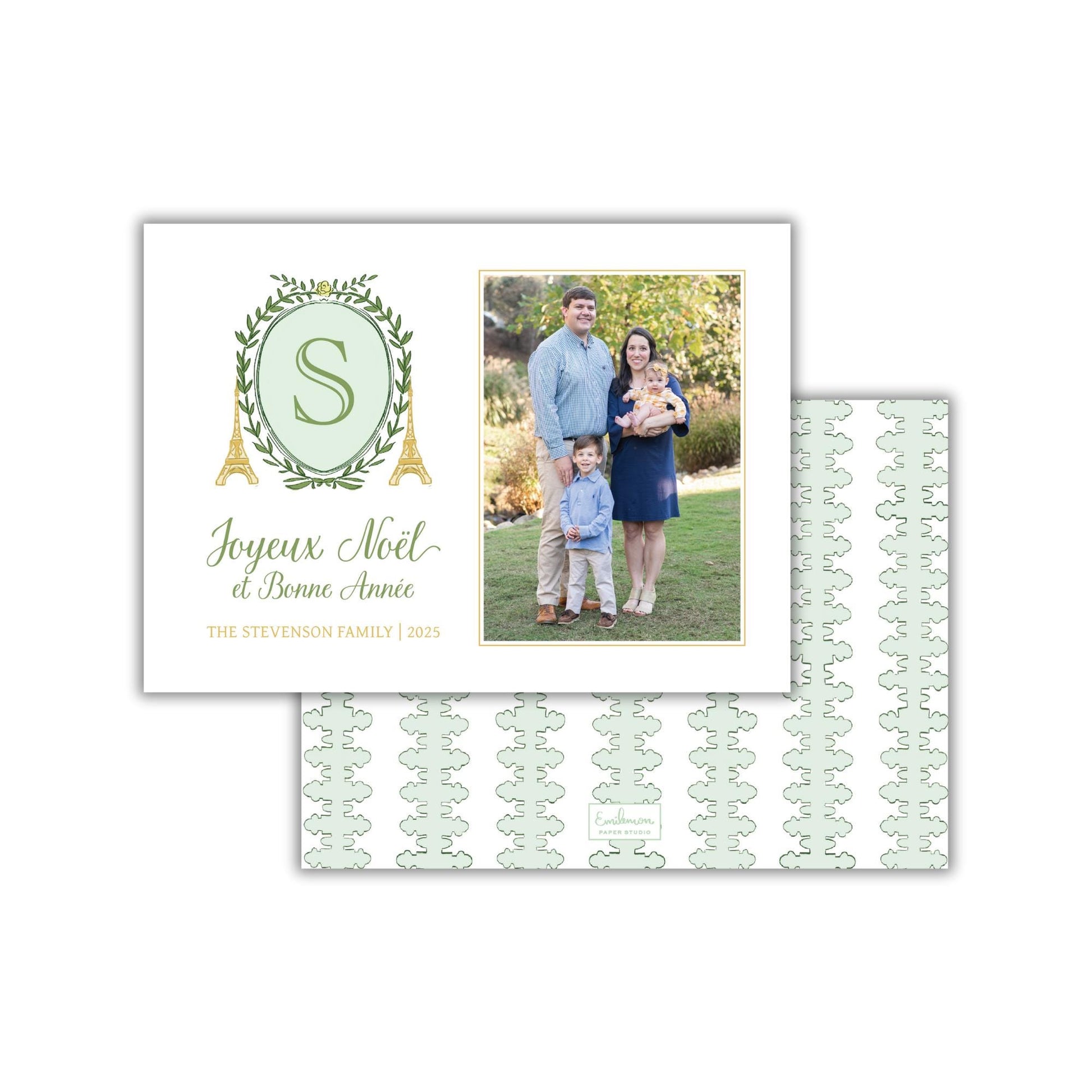 A family photo of a man, woman, and child, along with a greeting card featuring the family and a decorative element.