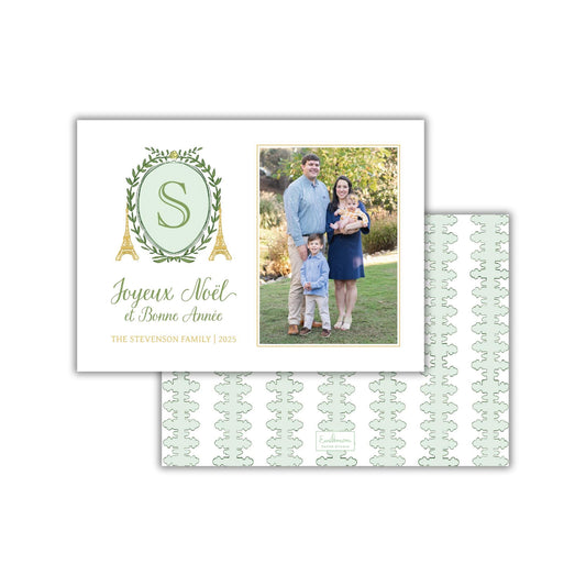A family photo of a man, woman, and child, along with a greeting card featuring the family and a decorative element.
