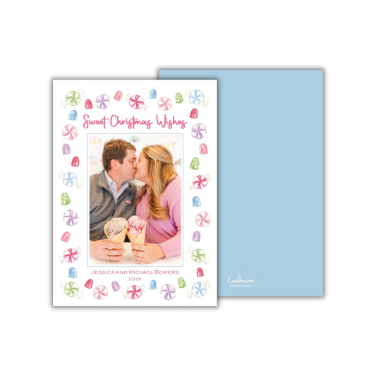 A couple embracing and kissing, with a background of colorful candy and sweets.