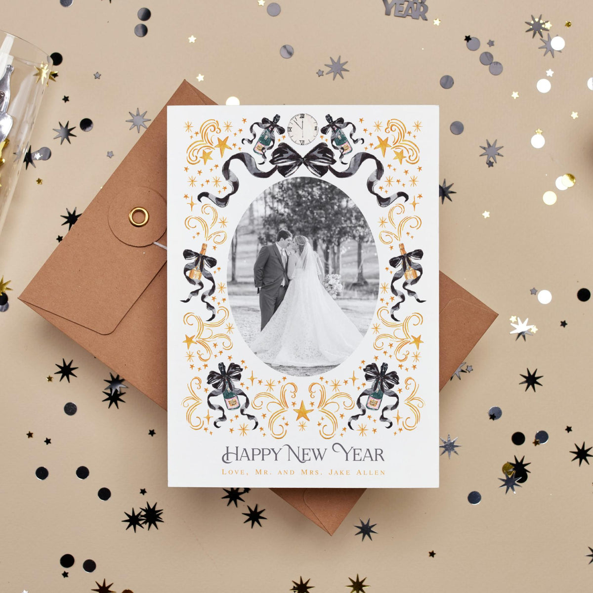A wedding card with a photo of a bride and groom, surrounded by decorative elements such as stars and bows, placed on a background of confetti.