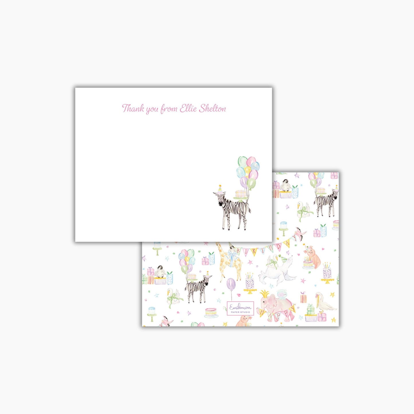 a white card with a pink message and a pattern of various animals, including zebras, giraffes, and elephants, along with balloons and other decorative elements.