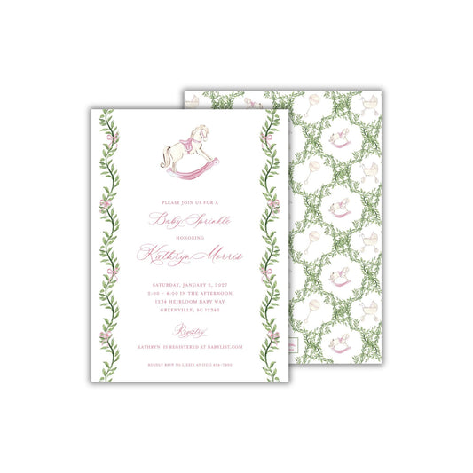 A rectangular 5 x 7 inch baby girl shower invitation featuring watercolor greenery and pink bows in a grandmillennial style, and a pink and white heirloom style rocking horse. The back pattern features a greenery trellis with the rocking horse, baby carriage, and baby rattles.