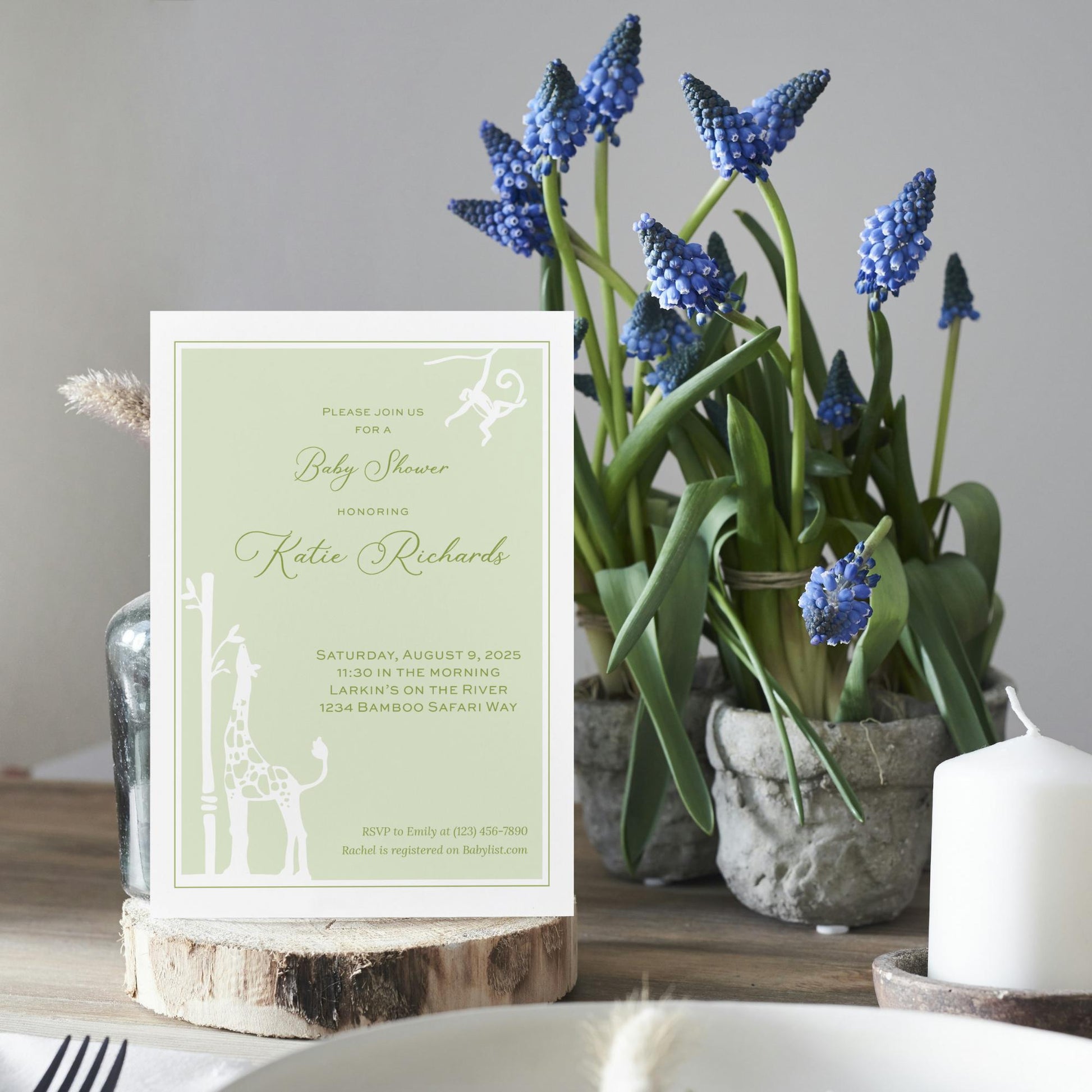 a table topped with a vase filled with blue flowers