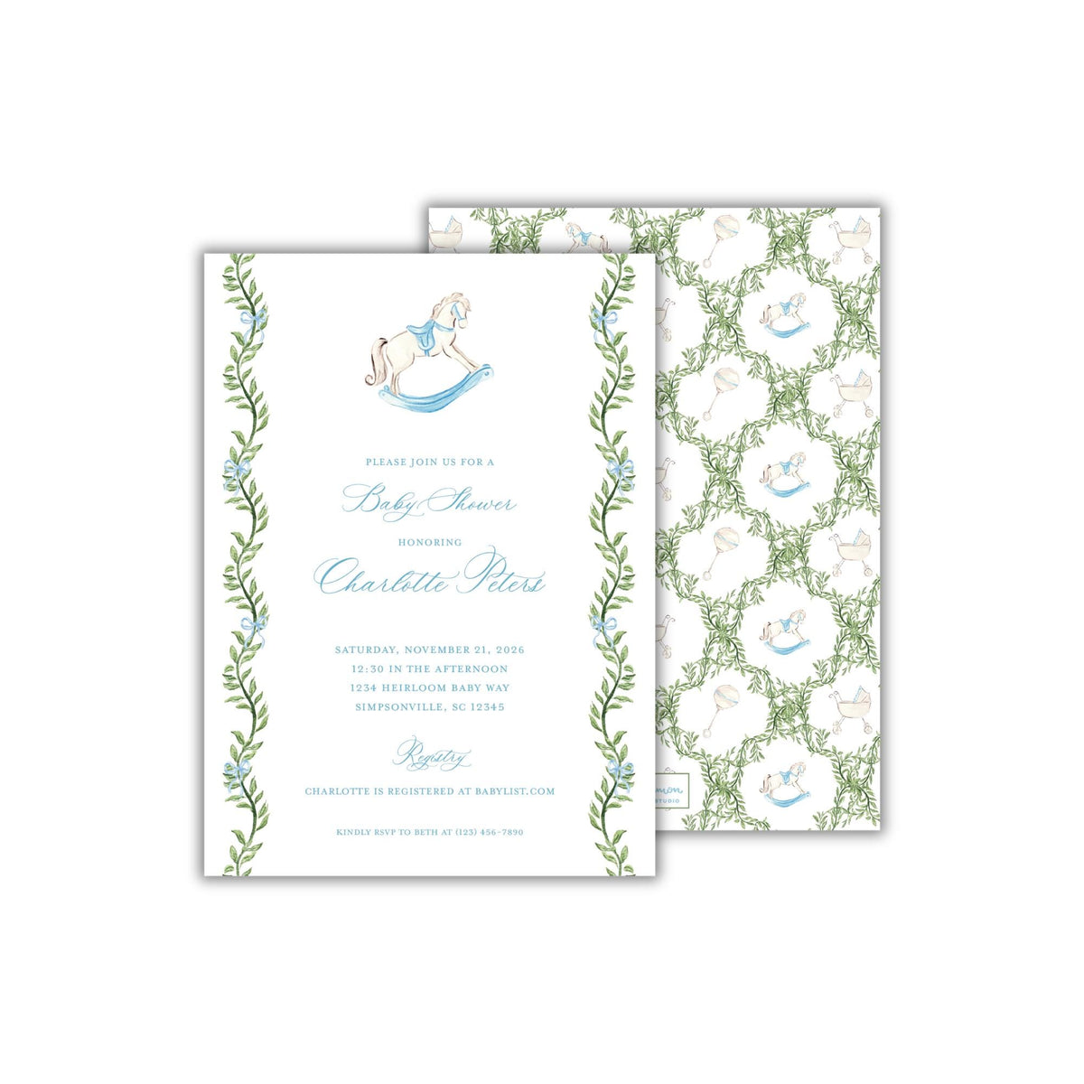 A rectangular 5 x 7 inch baby shower invitation featuring watercolor greenery and blue bows in a grandmillennial style, and a blue and white heirloom style rocking horse. The back pattern features a greenery trellis with the rocking horse, baby carriage, and baby rattles.