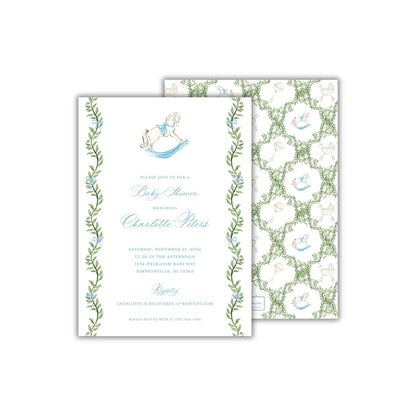 A rectangular 5 x 7 inch baby shower invitation featuring watercolor greenery and blue bows in a grandmillennial style, and a blue and white heirloom style rocking horse. The back pattern features a greenery trellis with the rocking horse, baby carriage, and baby rattles.