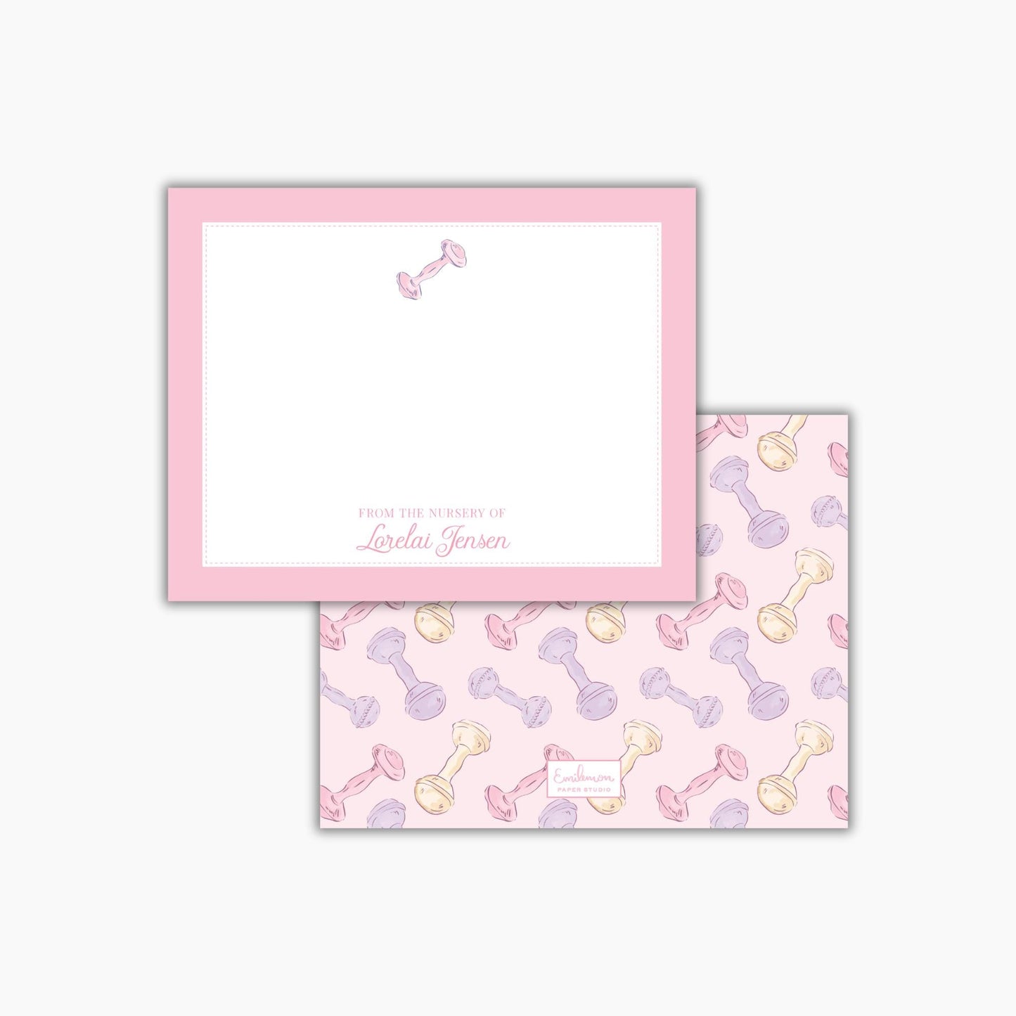 a pink frame with a blank space for writing, and a pattern of baby bottles in various colors on the back cover.