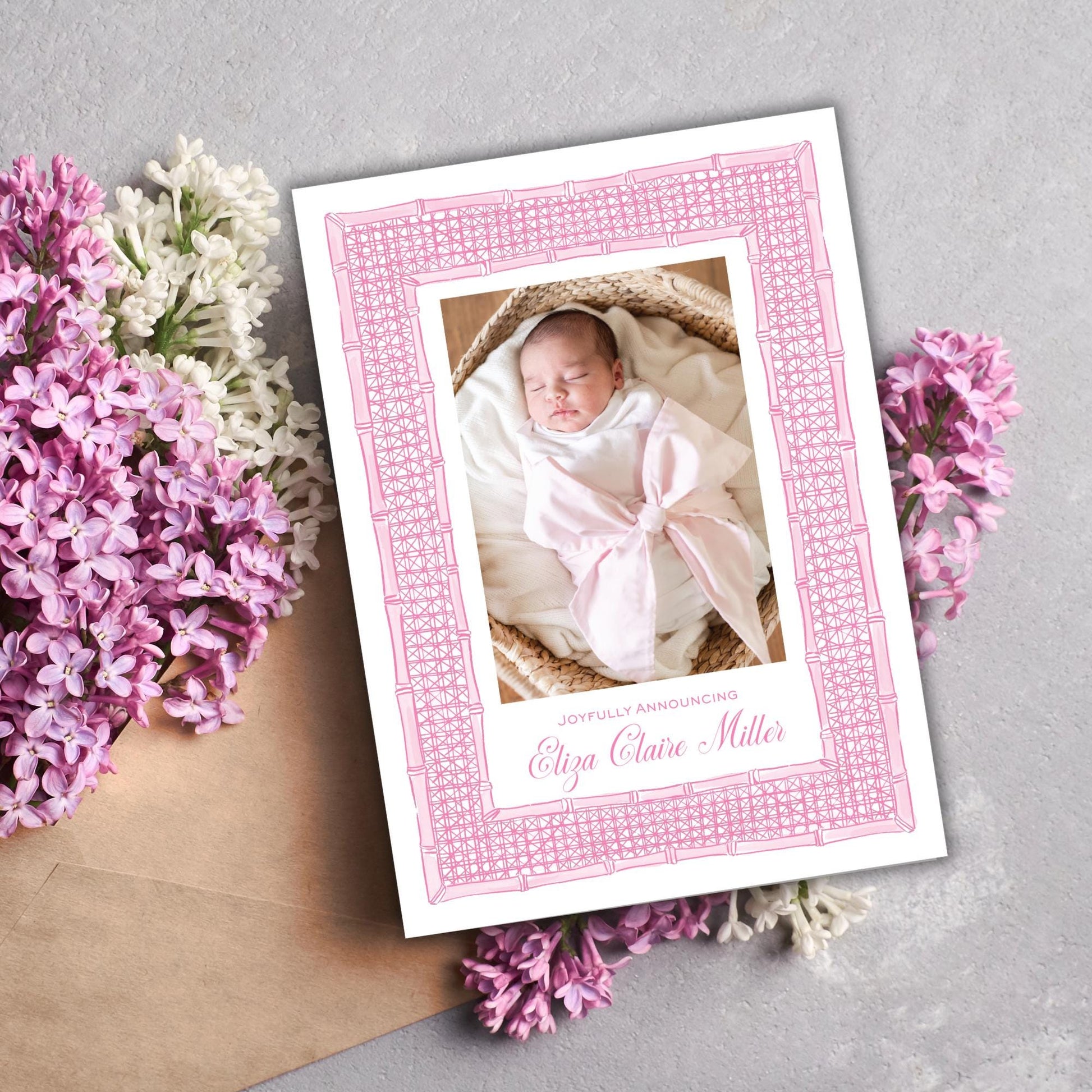 a card with a picture of a baby in a basket