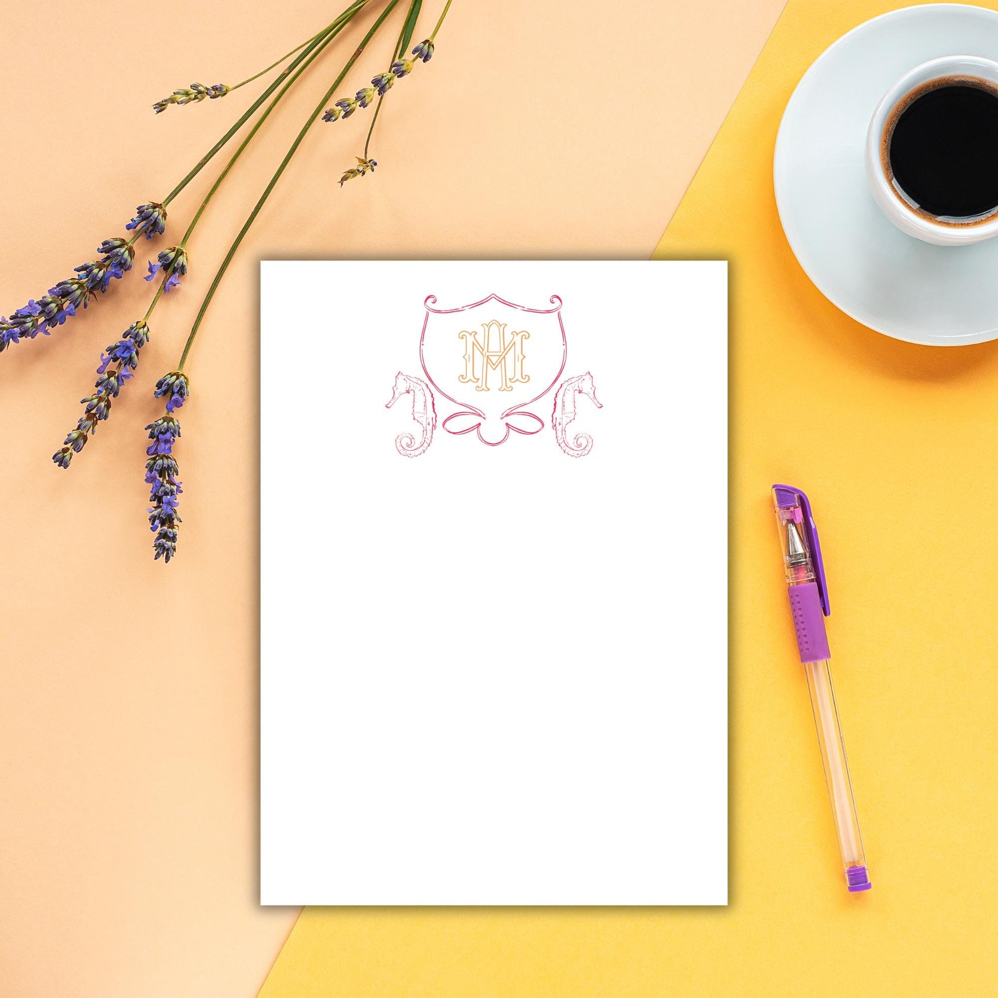 a cup of coffee and a notepad on a table