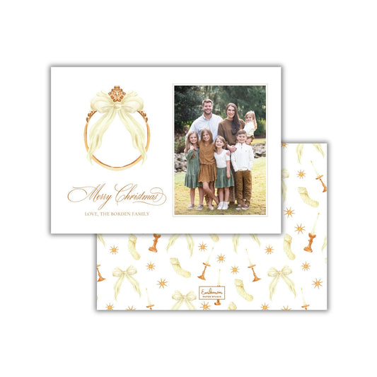A Christmas card featuring a family photo and a decorative bow.