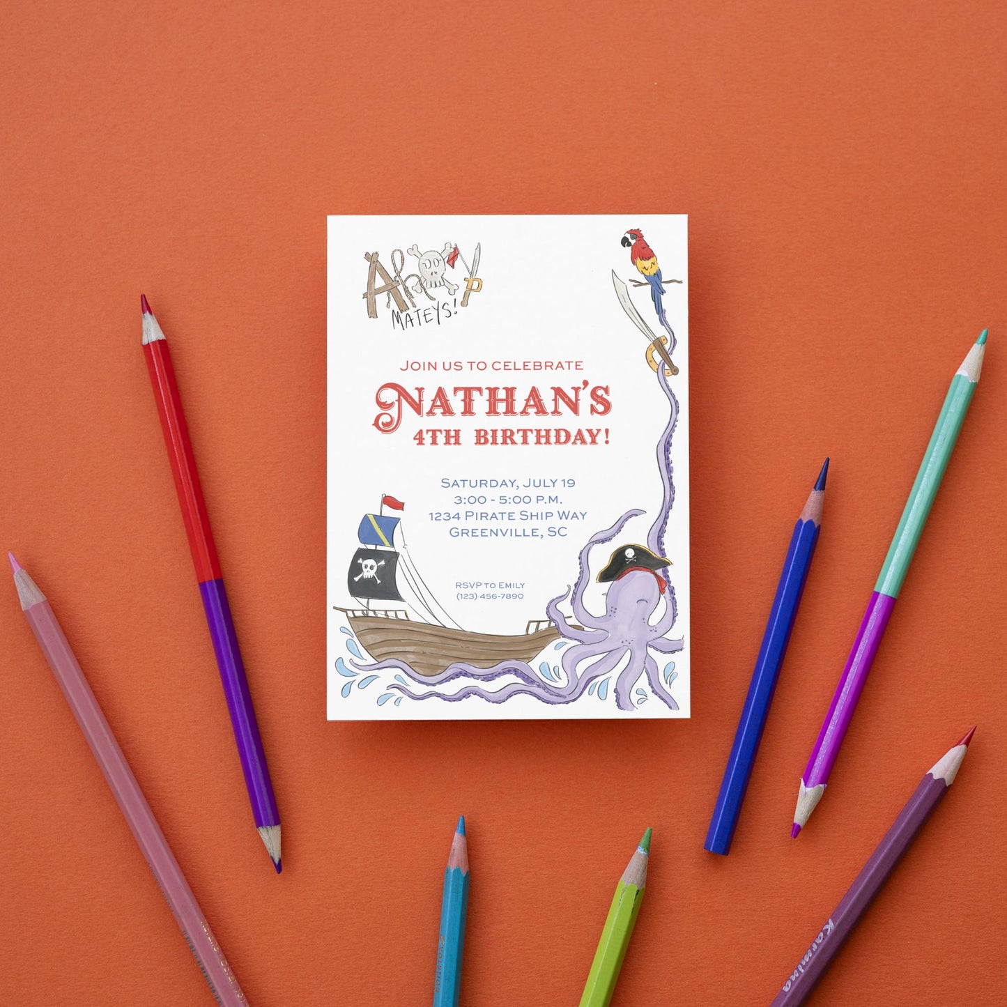 a birthday card with pencils and markers on an orange background