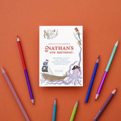a birthday card with pencils and markers on an orange background