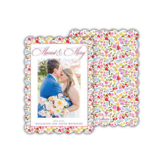 a couple embracing each other, with a floral pattern on the background.