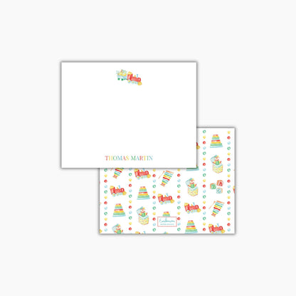 The image is a white square with a train design and a repeating pattern of colorful toy trains on the right side.