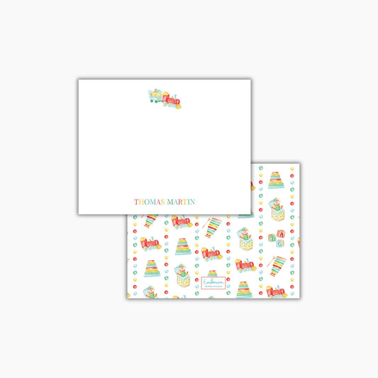 The image is a white square with a train design and a repeating pattern of colorful toy trains on the right side.