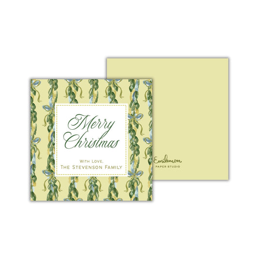 A square greeting card with a yellow background and a green floral pattern. The card has a message that reads &quot;Merry Christmas with love, The Stevenson Family&quot; and is designed to be a personalized holiday card.