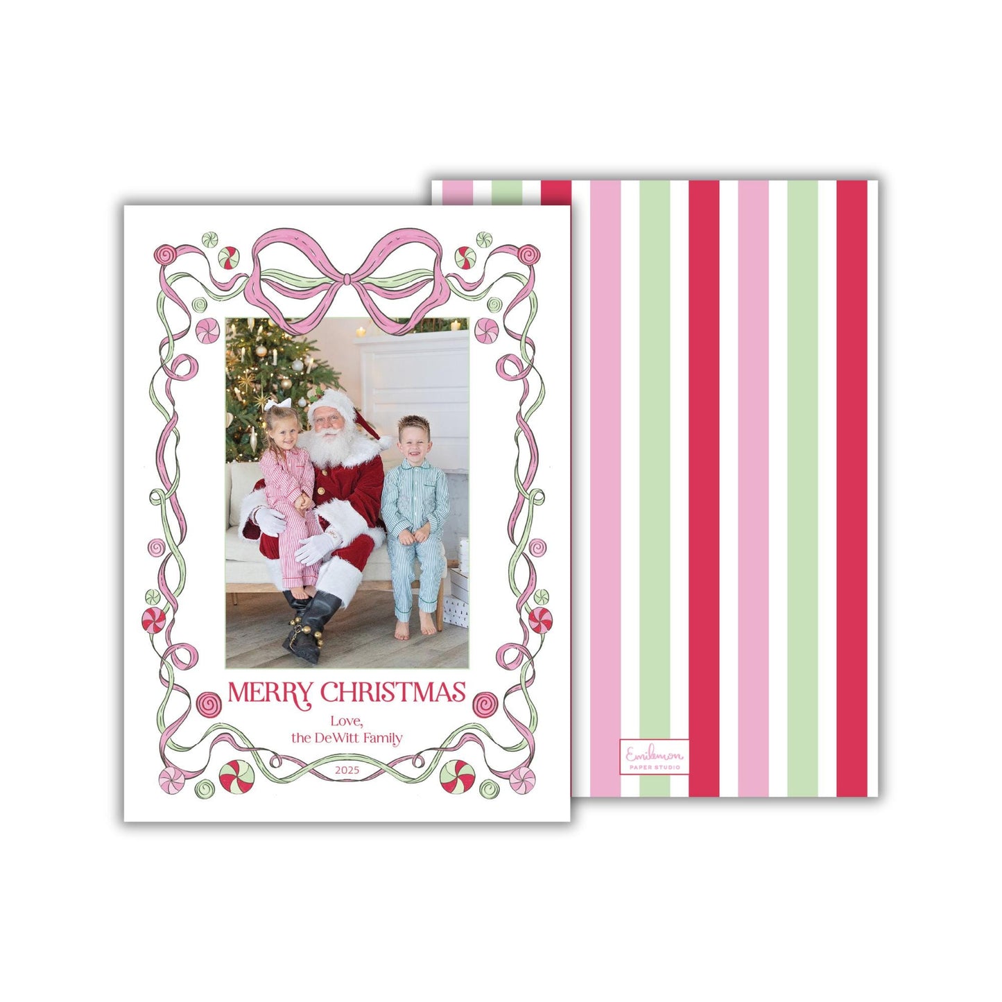 A Christmas card featuring a Santa Claus figure, with a family photo in the center. The card has a decorative border with pink and green stripes.