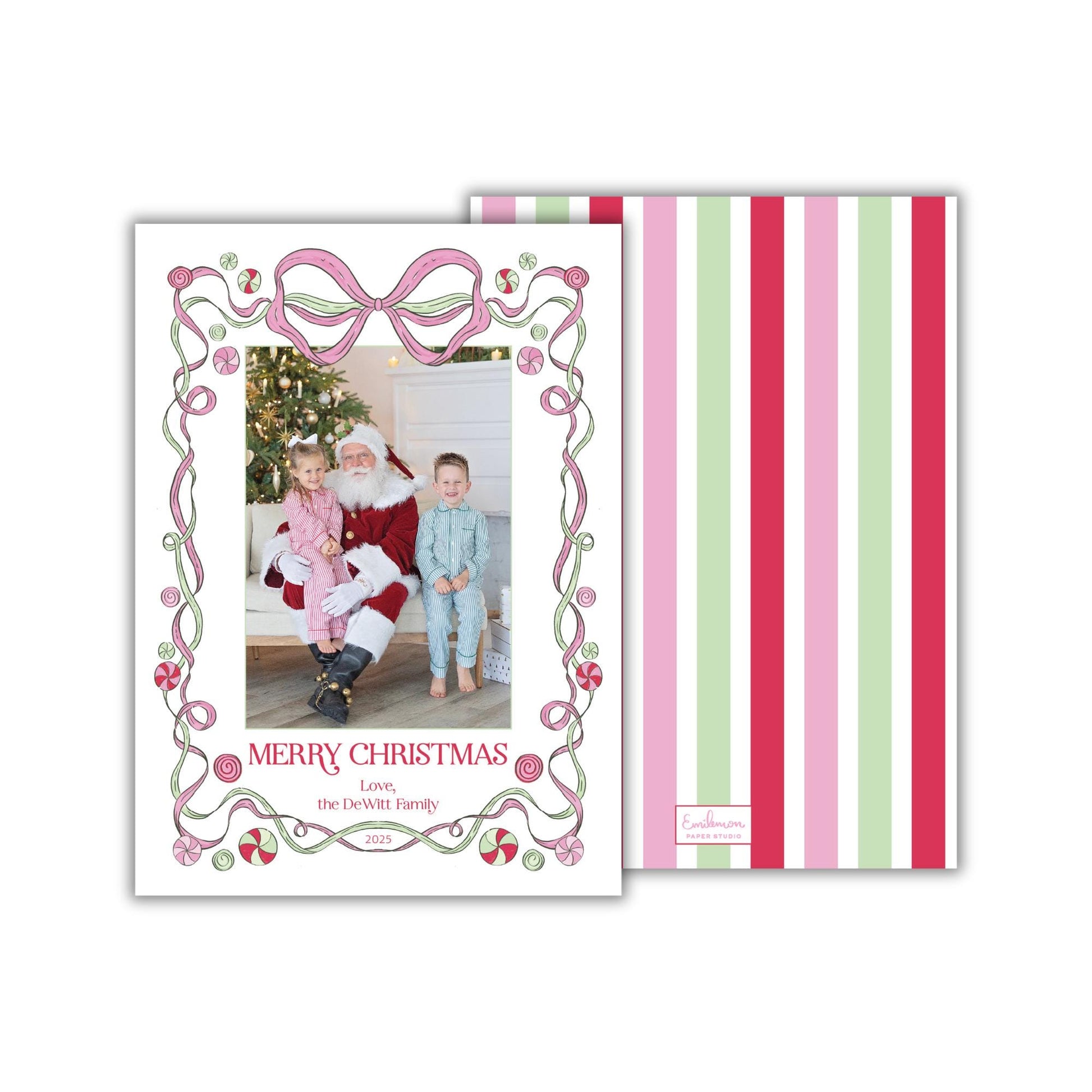 A Christmas card featuring a Santa Claus figure, with a family photo in the center. The card has a decorative border with pink and green stripes.