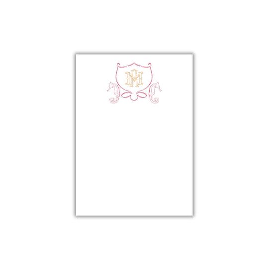 a white paper with a pink and red design on it