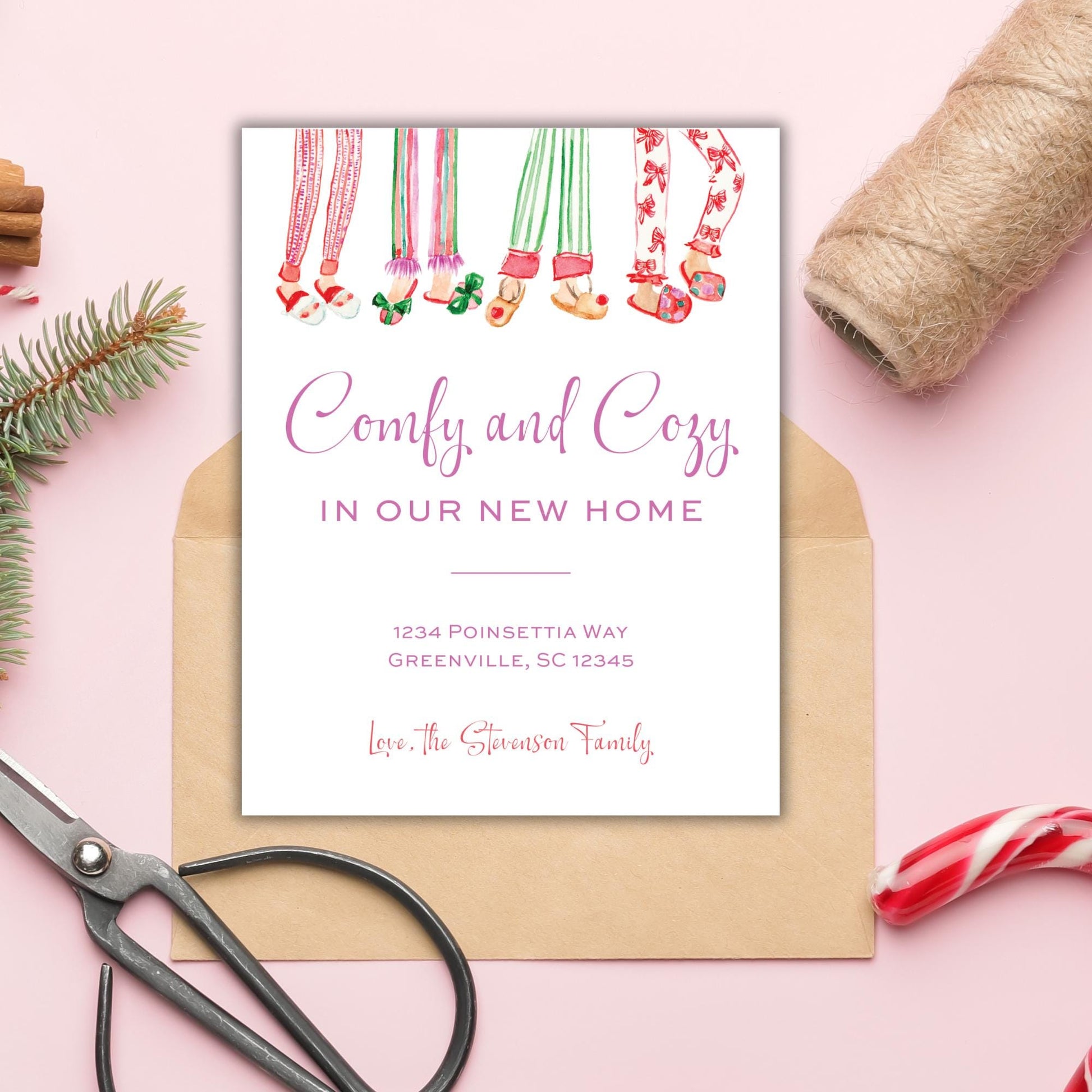 a card with a festive design, including illustrations of colorful socks and a Christmas tree, placed on a pink background.