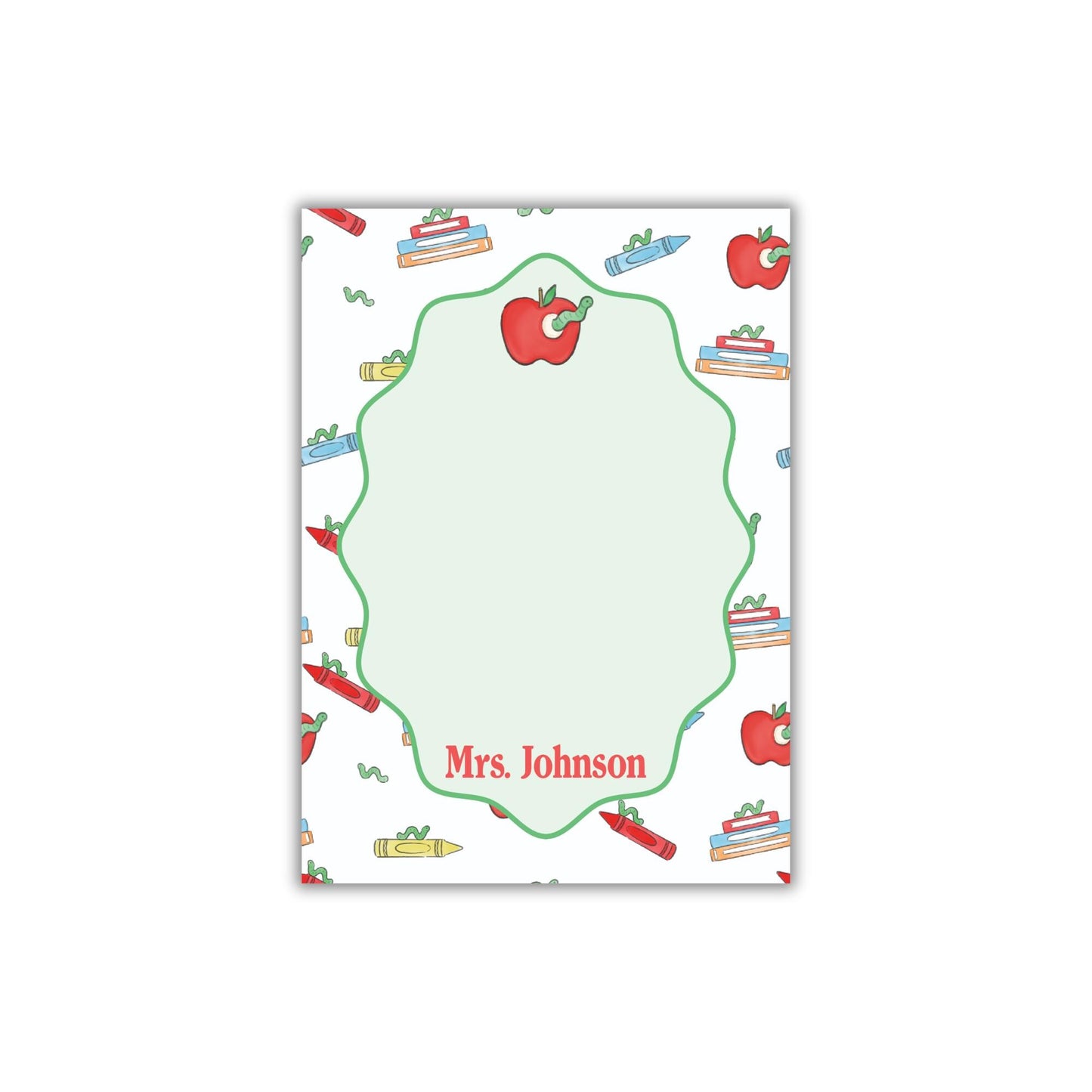 The image is a personalized nameplate with a repeating pattern of apples, crayons, and books. The nameplate has a green border and the name "Mrs. Johnson" written on it.