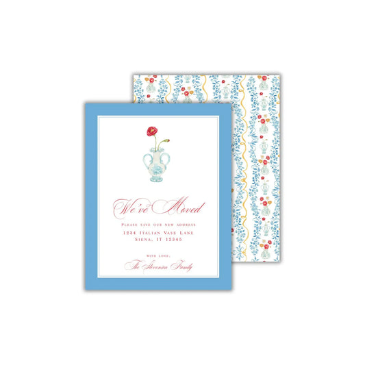 a blue and white wedding card with a flower on it